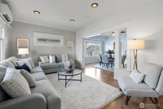Spacious Living and Dining Rooms are framed by some original leaded windows.