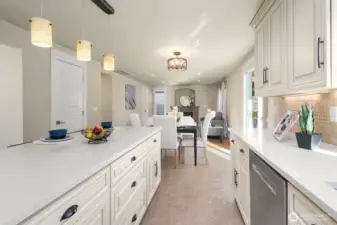 Looking from the induction stove towards the informal dining and family room.