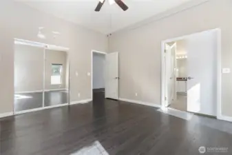 Primary bedroom with walk in closet and bathroom