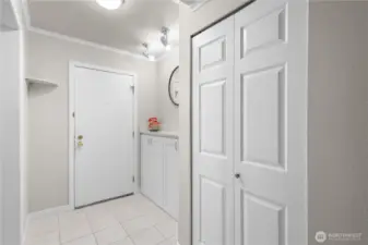 Entry way with a coat closet.