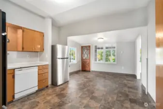 Large kitchen nook area is suitable for a large breakfast table providing flexible options for dining. Back door of unit A leads to staircase to access the backyard and shared laundry room with unit B.