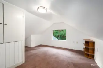 Upstairs bedroom #3 with window looking towards backyard.