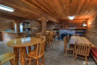Inside with clubhouse with full kitchen, table and chairs