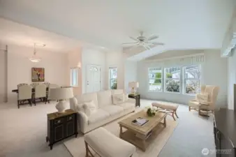 The large living area, which is adjacent to the dining room, offers endless entertaining options.   *virtually staged