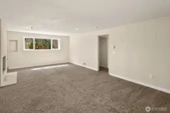 Lower level rec room with wood burning fireplace