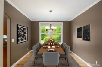 Formal dining room features large windows, crown molding and hardwood floors.