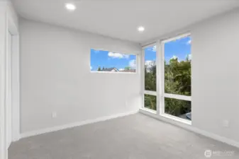 2nd upstairs bedroom with floor to ceiling windows