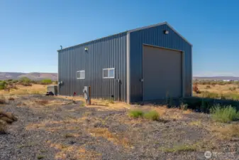 Big shop with insulation, heater, half bath, Two RV hookups and EV charging station