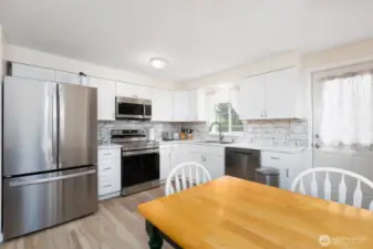 Freshly remodeled kitchen with stainless steel appliances.