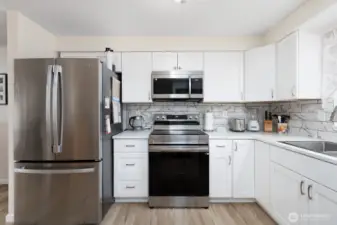 Brand new cabinets, fresh paint and tile backsplash.