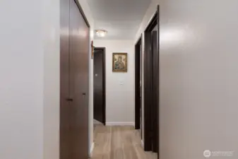 Hallway to bathroom and bedrooms.