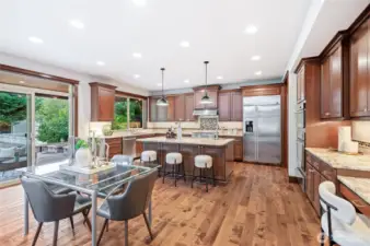 Flowing floor plan with informal dining spaces, large kitchen, and outdoor access.