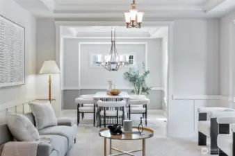 Formal living room, and dining room spaces with recessed ceilings.