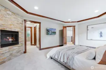Sumptuous primary suite with cozy gas fireplace