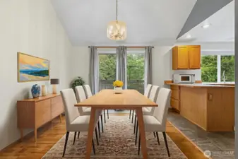 Dining room conveniently located between the kitchen and family room. Easy access to the deck through the sliding glass doors. Note: Virtually staged.