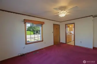 Living room, front door and entrance to kitchen