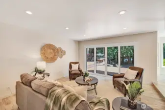 Family room is adjacent to kitchen and flows seamlessly to the outdoors.