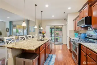 Island sink with newer gas stove.
