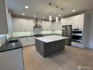 Upgraded KitchenAid appliances,  including a Wall oven & microwave.  6 burner gas cooktop and French door Refrigerator.