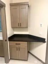 Laundry room on upper floor can be accessed from hallway, or directly from the primary suite bathroom.