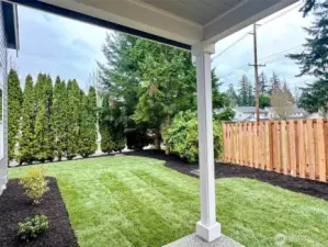 Covered patio and very nice sideyard.