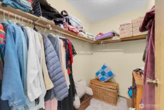 Primary bedroom walk in closet