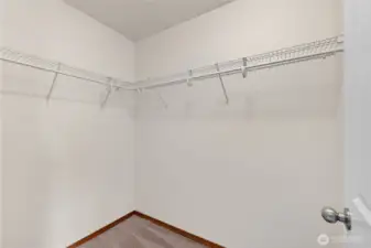 1 of 2 walk-in closets in primary