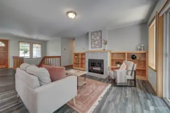 The family room has tasteful wood built-ins and gas fireplace.