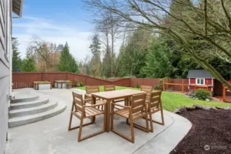 Gorgeous concrete patio with nice dining area