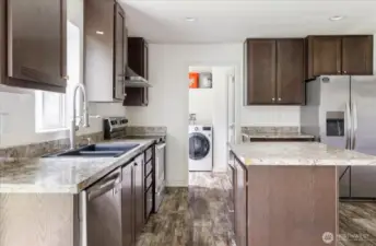 Kitchen looking into laundry