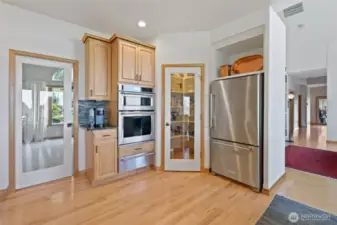Kitchen has a walk in pantry and pocket door to dining room.