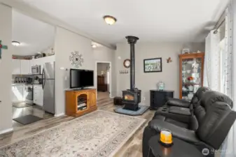 Step Inside to Easy Care Laminate Floors, a Cozy Wood Burning Fireplace, and Vaulted Ceilings!