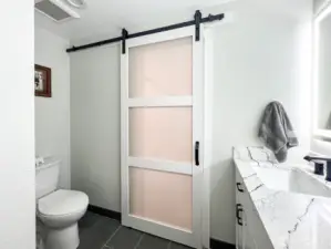 Bathroom with entry from primary bedroom and hallway