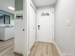 Front door from the inside, entry to the garage through the utility room
