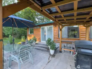 Large back patio with covered pergola