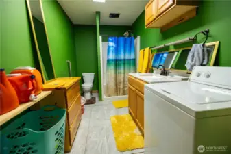 Shop apartment bathroom with laundry facility