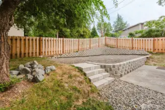Can't you just see the patio lights, patio table and chairs and your planter full of flowers? What a great space for entertaining or just sitting enjoying your own private area!