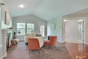 Vaulted ceilings and a cozy gas fireplace provide a warm spacious vibe.