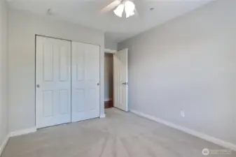 Second bedroom with ceiling fan.