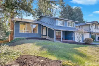 Wonderful curb appeal with new windows, exterior paint, and landscaping!