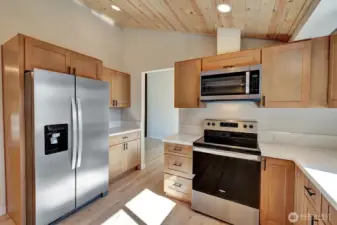 Another view of this stunning kitchen with vaulted ceilings as well!