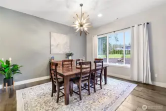 Lovely dining room is large and looks out to the backyard!