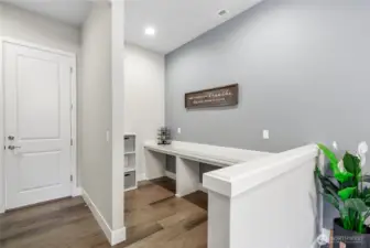 This spot is off the dining room and has a built in desk area that can serve as a homework station, remote workspace, homeschool area or even a coffee of wine bar!