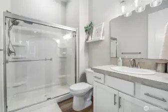 This is the bathroom off the main floor bedroom.  Large walk in shower and again those beautiful floors!