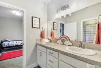 The 2 bedrooms upstairs feature a bathroom in between with double sinks, lots of cabinet and counter space.