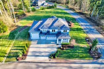 Drone shot shows the ample parking, spacious lot and the HUGE RV garage!  This is the one you have been waiting for!  Call for your private showing today!
