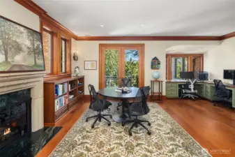 Enjoy this expansive and light-filled office with built-ins.