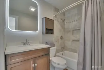 Bathroom has interior doors from main bedroom and hallway for convenient access.