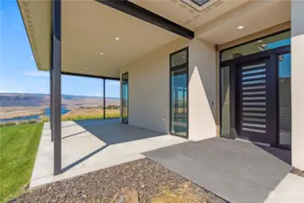 This home's enchanting view of the Columbia River beckons from the moment you arrive at the front door. Step inside to discover a seamless blend of indoor-outdoor living, with floor to ceiling windows and an expansive L-shaped covered patio.