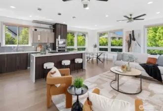Open-concept living flows to kitchen and dining—lush landscaping provides privacy.